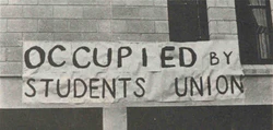 A banner displayed outside Senate House during the occupation.[36]